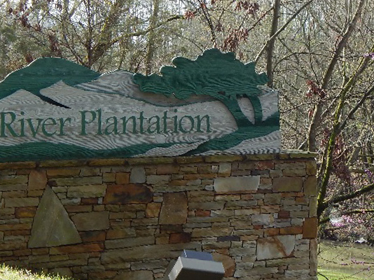 masonry sign for the River Plantation community